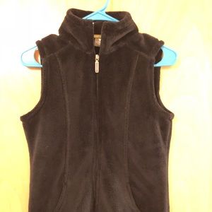 White Sierra plush black vest.